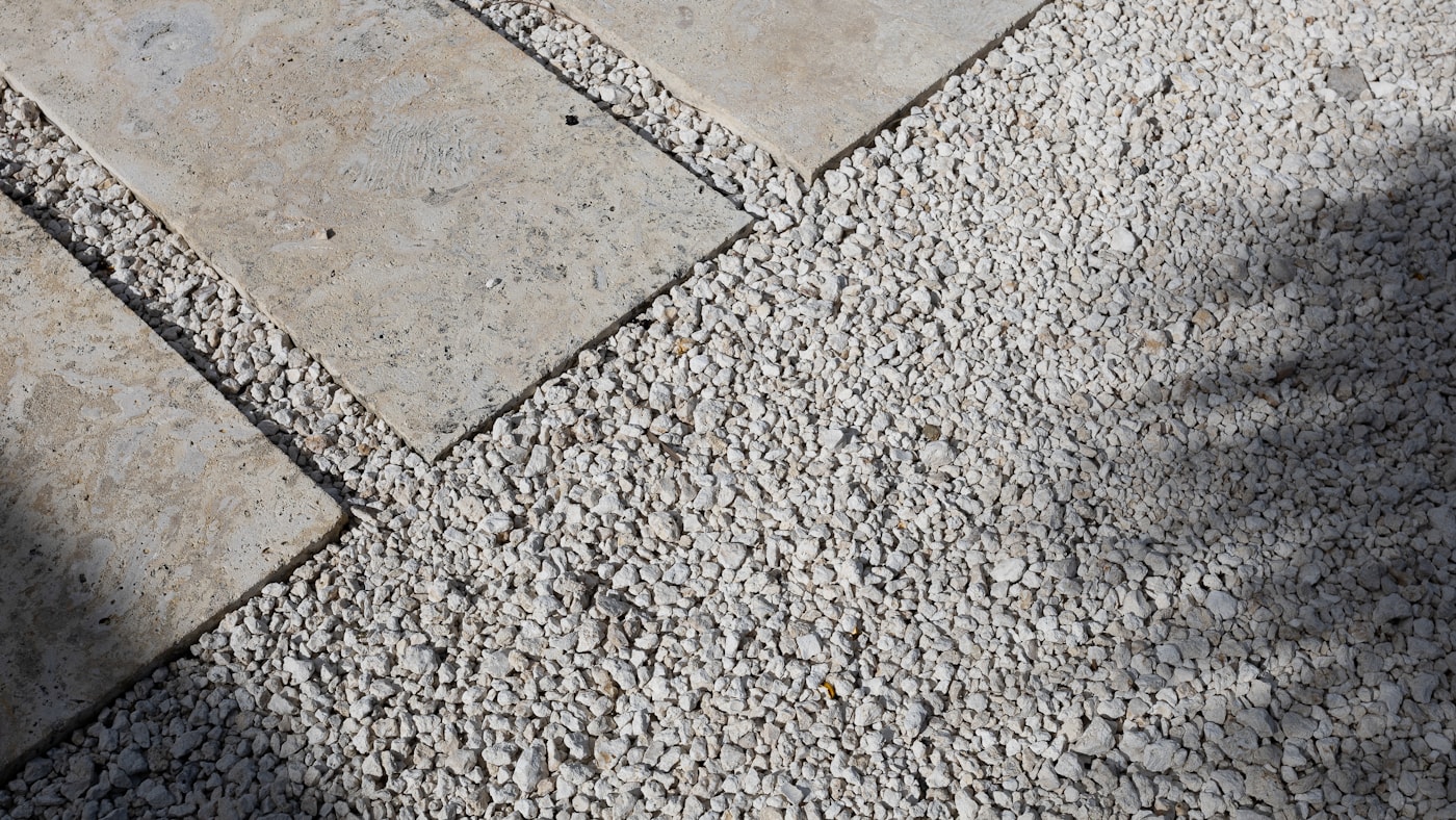Stone pavers set into pale decorative gravel